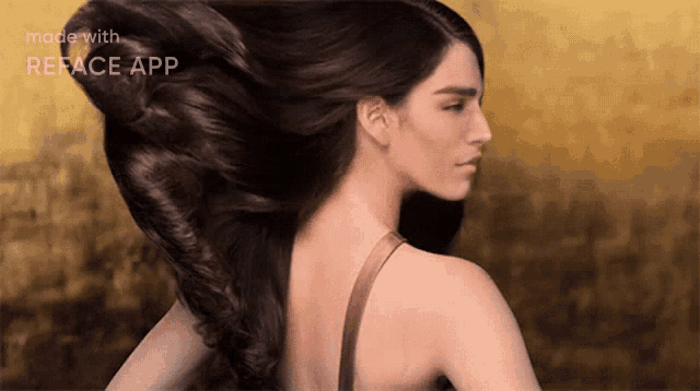 a woman 's hair is blowing in the wind with the words made with reface app on the bottom