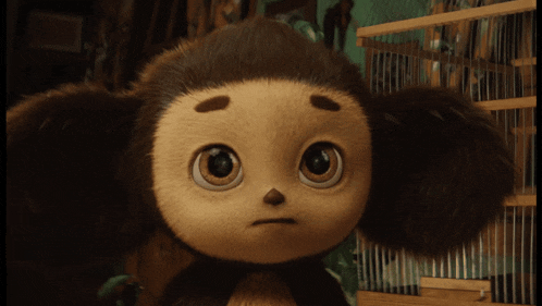 a close up of a stuffed animal with a serious look on its face