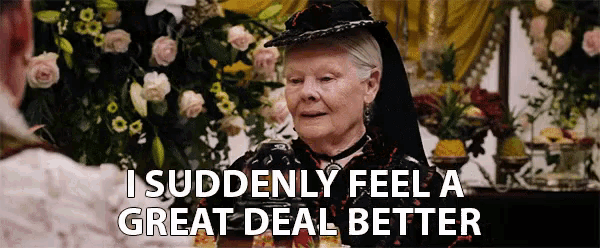 a woman in a black hat is talking to another woman and says i suddenly feel a great deal better