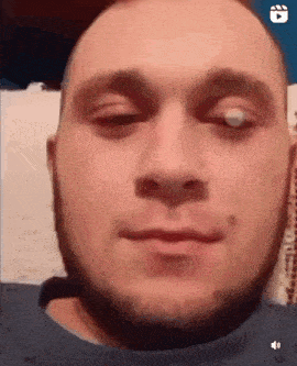 a close up of a man with his eyes closed