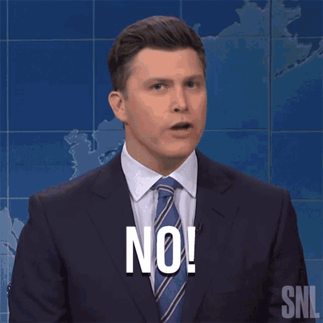 a man in a suit and tie says no in front of a map .