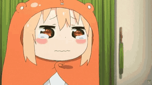 a cartoon girl wearing a bear hat is crying and making a funny face .