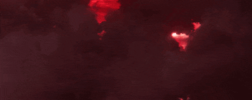a red background with a light coming out of the middle