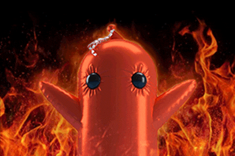 a red balloon with blue eyes is in front of a fire background