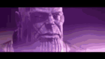a close up of a man 's face with a beard and a purple background .