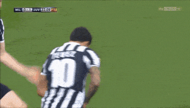 a soccer player with the number 19 on his back kicks the ball