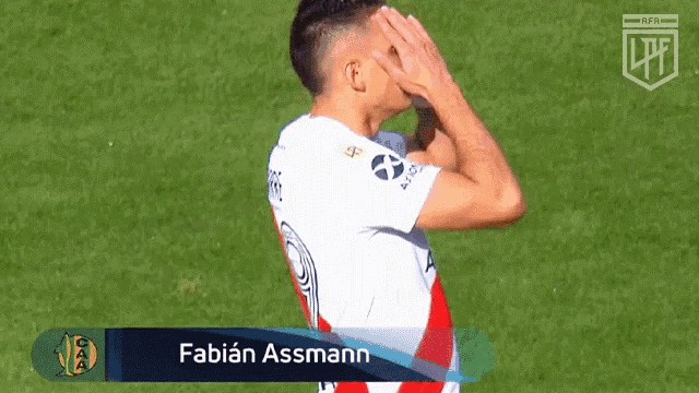 a soccer player with the name fabian assmann on the back of his shirt