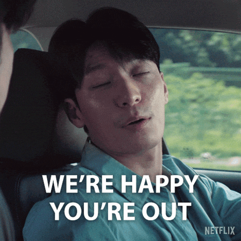 a man in a car says " we 're happy you 're out " in white letters