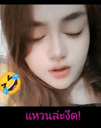 a close up of a woman 's face with a smiley face behind her and the words " i 'm laughing "