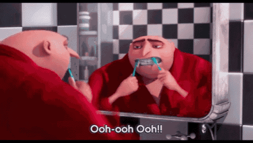 a cartoon character is brushing his teeth in front of a mirror and says ooh-ooh-ooh!