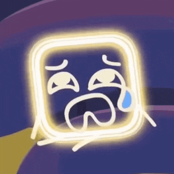 a neon sign with a crying face inside of it .