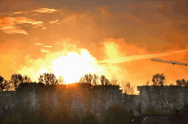 the sun shines brightly through the clouds above a city
