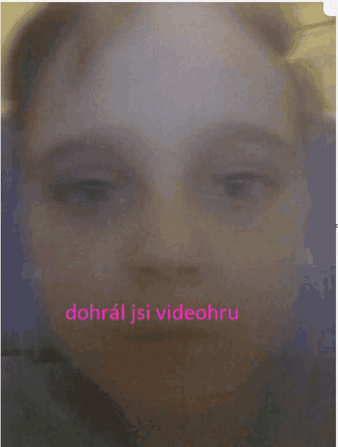 a blurred image of a woman 's face with the words dohral jsi videohu written in pink