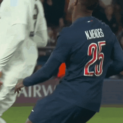 a soccer player with the number 25 on his back
