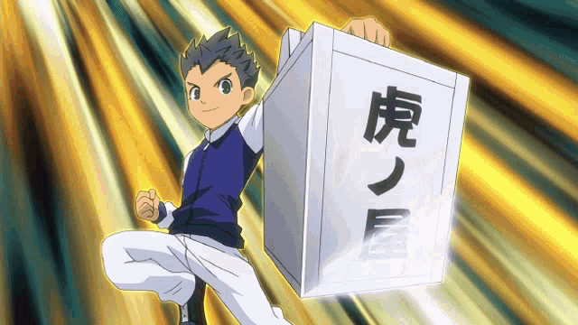 a boy holding a box with chinese characters on it