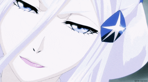 a close up of a person 's face with a blue star on her ear