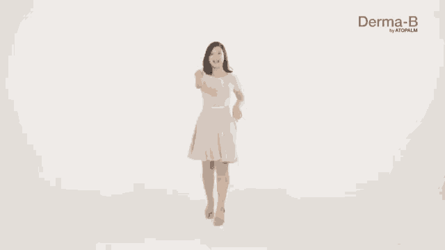 a woman in a dress is dancing with her arms outstretched .
