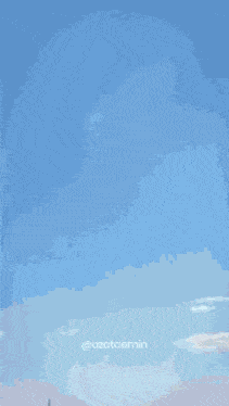 a blue sky with a few clouds and the words @ozataemin