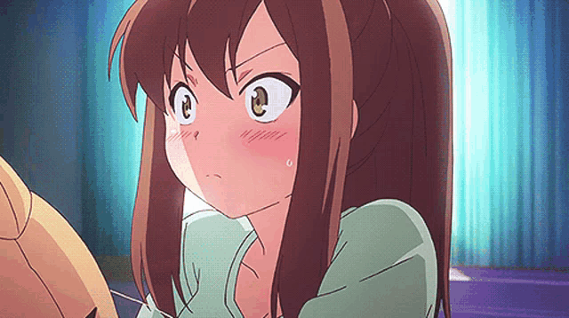 a close up of a girl with brown hair making a face