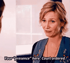 a woman is talking to a man and says your presence here court ordered .
