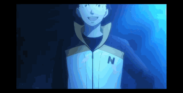 a man wearing a jacket with the letter n on it is smiling