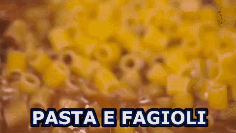 a close up of a pile of pasta with the words pasta e fagioli above it