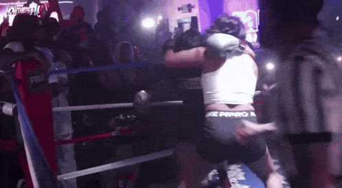 a woman in a boxing ring with the word pro on the side