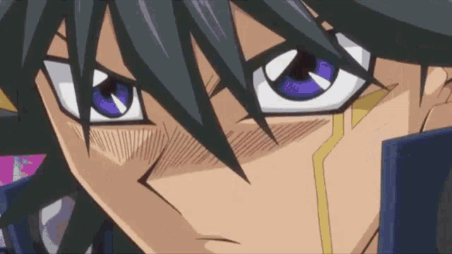 a close up of a cartoon character 's face with blue eyes