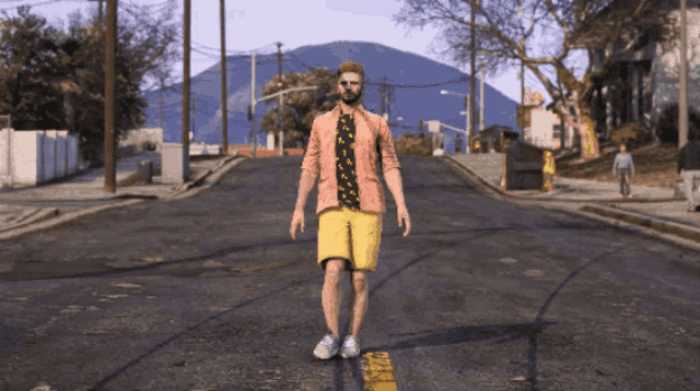 a man in a pink jacket and yellow shorts stands in the middle of a street