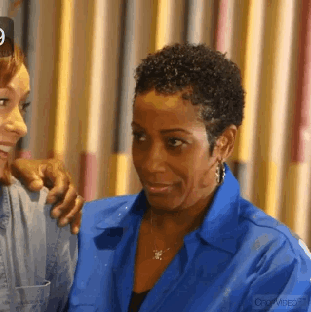 a woman in a blue shirt with crop video on the bottom