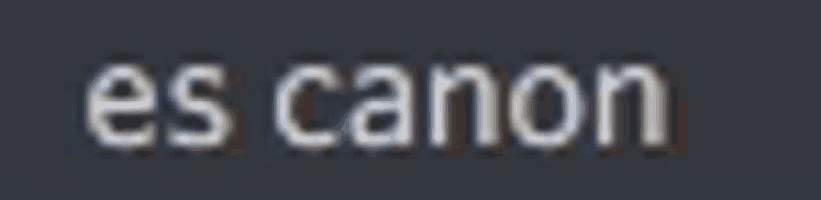 a blurred image of the word canon on a black background