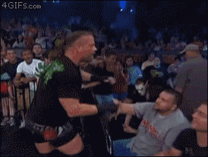 a man wearing a mask and a shirt that says sting on it
