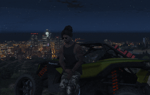 a man sits in a kawasaki atv in front of a city