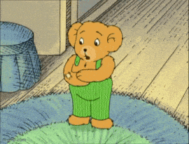 a cartoon of a teddy bear in green striped pants