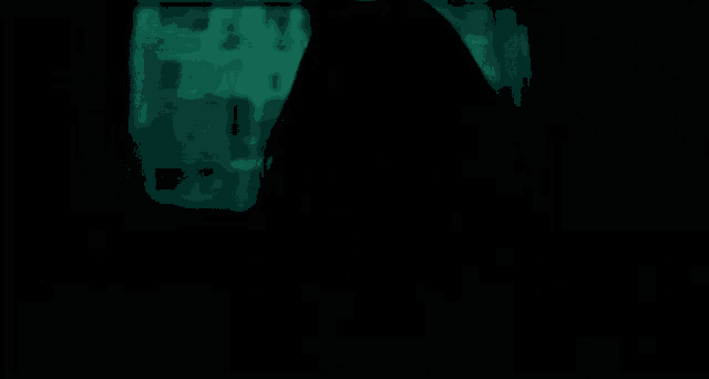 a woman is holding a candle in her hand with a green background