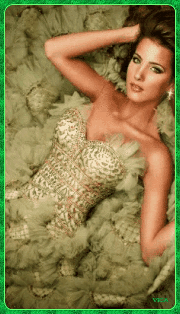 a picture of a woman in a dress with a green frame that says victoria