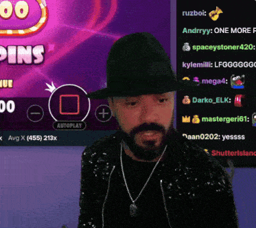 a man wearing a hat is playing a video game with a purple background that says coins