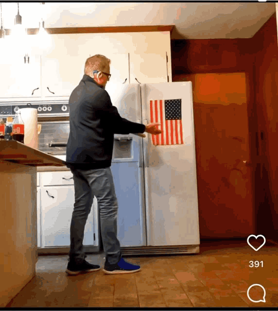 a man standing in front of an american flag on a refrigerator