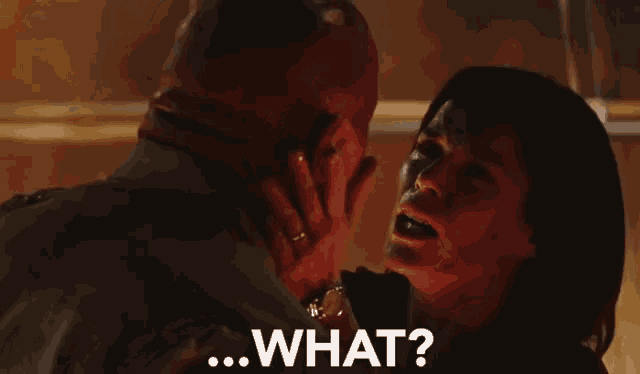 a man and woman are looking into each other 's eyes and the woman is saying " what "