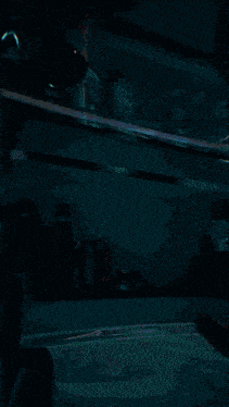 a blurred image of an open refrigerator with a bottle of sprite on the shelf
