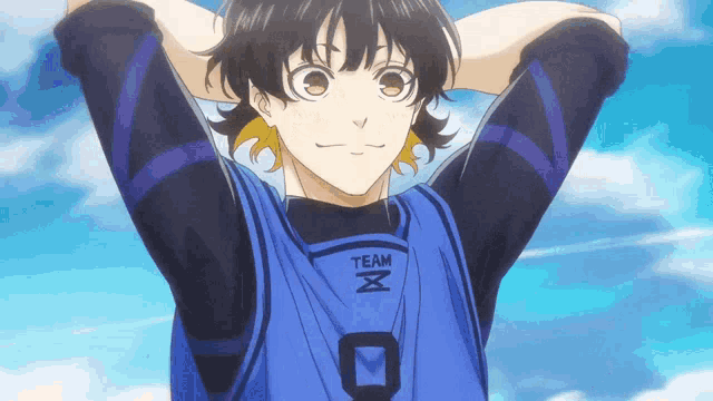 a boy wearing a blue shirt that says team x