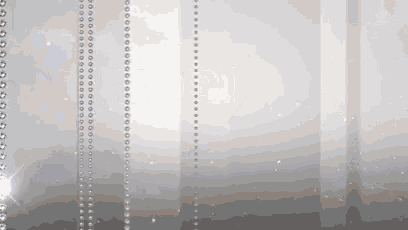 a white background with a row of silver beads
