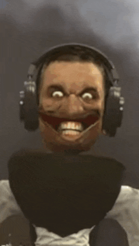 a man wearing headphones making a funny face