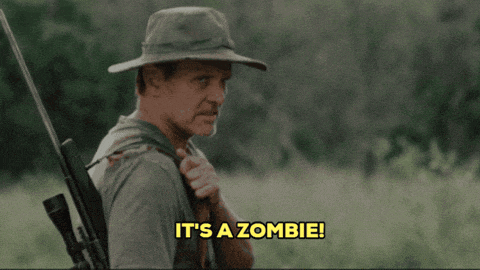 a man holding a rifle says " it 's a zombie "