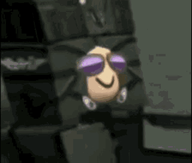 a cartoon character wearing purple sunglasses is standing next to a stack of boxes .