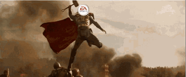 a man in a red cape is holding a hammer with the ea sports logo on his head