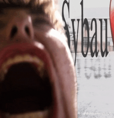 a close up of a person 's face with the word sybau written on it