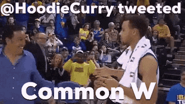 a basketball player with a towel around his neck is being congratulated by a man in a crowd .