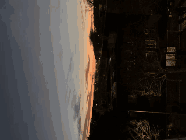 an upside down picture of a sunset over a city