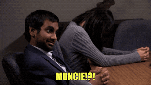 a man and a woman sit at a table with the words muncie written on the bottom